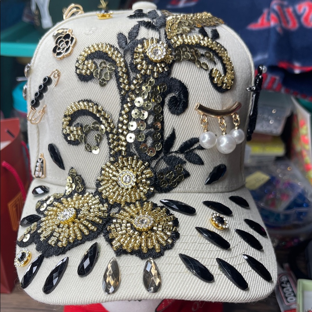 Embellished Cap with Gold and Black Accents